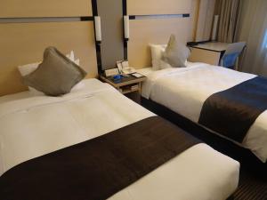 Ліжко або ліжка в номері Hotel Toyota Castle