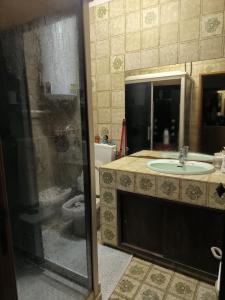 a bathroom with a shower and a sink at GamaBarros1-Charneca in Charneca