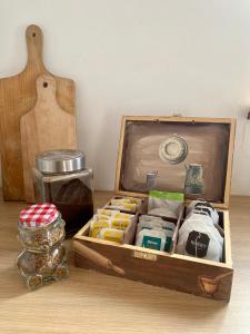 a wooden box filled with different types of food at Domek Wśród Pól z Balia Jacuzzi in Rawa