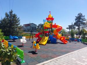 a playground in a park with a play equipment at Complex Casa Ani in Eforie Nord