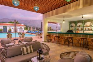 a resort with a bar and a swimming pool at Mount Elgon Hotel & Spa in Mbale