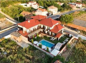 an aerial view of a house with a swimming pool at Einstein House & Spa in Marchevo