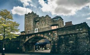 an old stone bridge with a building on top at Kellys Place Derry City Centre in Derry Londonderry