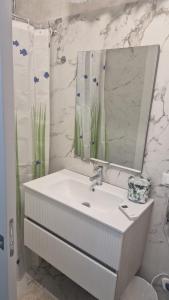 a white bathroom with a sink and a mirror at Dimora ANETT B&B HOUSE in Codevigo +29 photos