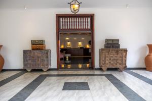 a room with two chests and a doorway to a store at Mount Elgon Hotel & Spa in Mbale