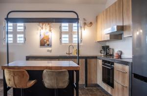 a kitchen with a island in the middle at Watervillas Breezy Bay in Kralendijk