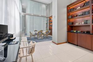 a kitchen and dining room with a table and chairs at MonteCarlo Miami Beach in Miami Beach +56 photos