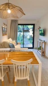 a living room with a table and a couch at Cabañas Sol de Abril in Mar del Plata