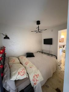 a bedroom with a bed with two pillows on it at Apartman Lala in Nova Varoš