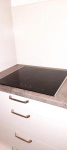 a microwave oven sitting on top of a counter at Havre De Paix Réside in Le Mée-sur-Seine