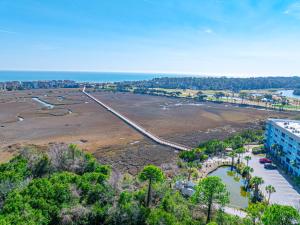 an aerial view of a beach and a building at Resort Retreat - Multiple Pools - Beach Access in Hilton Head Island