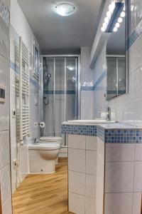 a bathroom with a toilet and a sink at Villa Maria Gaeta in Gaeta +30 photos