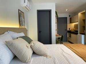 a bedroom with a bed with two pillows on it at FLAT Intermares HUB 105 in Cabedelo