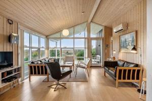 a living room with a couch and a table at JB406-Fjerritslev-Aspevej-68 in Fjerritslev