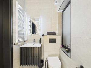 a bathroom with a toilet and a sink at Romantic Studio Marki LoveAparts in Marki +49 photos