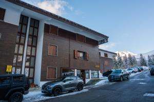 a car parked in front of a building at Eco Home - Val di Luce in Abetone