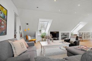 a living room with two couches and a coffee table at 20427-Samso-Torup-13 in Torup
