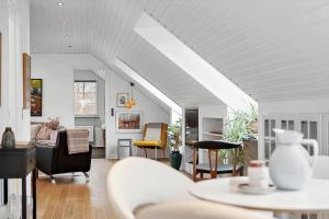 a living room filled with furniture and a white ceiling at 20427-Samso-Torup-13 in Torup