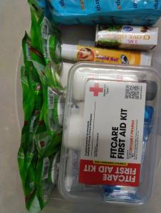 a plastic container filled with tooth brushes and toothpaste at Guru Rooms in Tiruvannāmalai