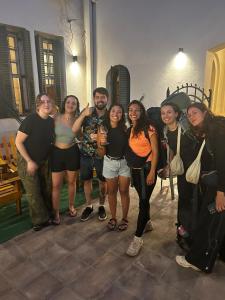 a group of people posing for a picture at Hostel Plaza in Mendoza