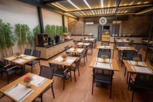 an overhead view of a restaurant with tables and chairs at Myway Deluxe Hotel in Konak