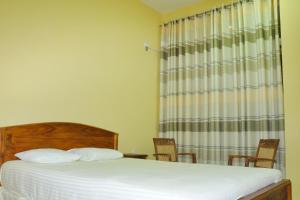 Voodi või voodid majutusasutuse Hotel Pearl Gate toas