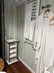 a closet with a towel rack and a window at LA MAISON DES HIPPOCAMPES in La Teste-de-Buch +17 photos