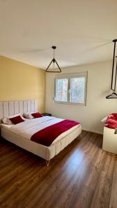 a bedroom with a large bed in a room at Zen Villas 1 - Zen Retreat in Gnjilane