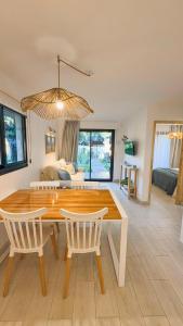 a dining room with a table and two chairs at Cabañas Sol de Abril in Mar del Plata