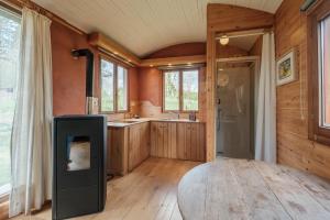 a large bathroom with a shower and a sink at La roulotte Ô Cwèrbâs in Gouvy +14 photos