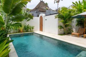 a pool in the backyard of a villa at Unity Villa 1 Canggu in Canggu