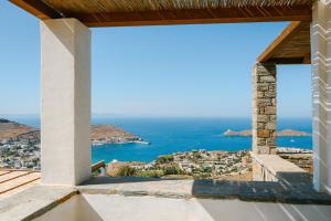 a view of the ocean from the balcony of a house at Sunset Heaven Villa on Kea in Korissia