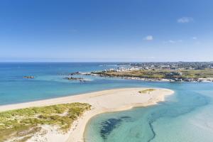 an aerial view of a beach in the ocean at ty loft keremma in Tréflez