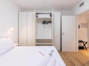 Postelja oz. postelje v sobi nastanitve GINO SUITES - Bilocali Luxury - Appartamenti vicini a Rho Fiera e Milano