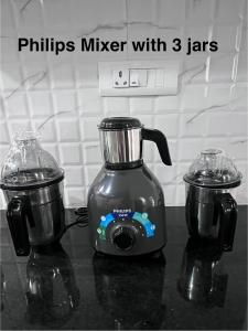 a philips mixer with jars sitting on a counter at shankara stays in Bangalore