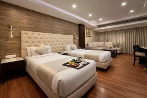 เตียงในห้องที่ Hotel O2 Oxygen