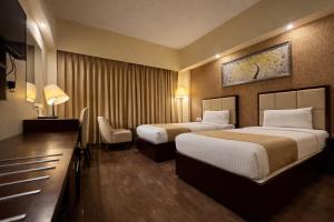 เตียงในห้องที่ Hotel O2 Oxygen