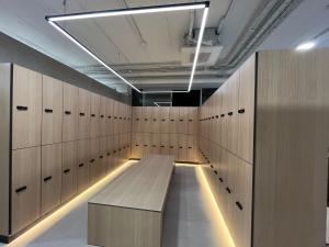 a locker room with a wooden bench in it at Hotel Balneario La Hermida in La Hermida