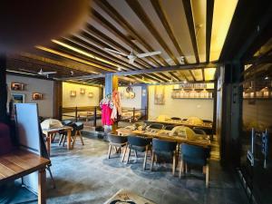 a dining room with a table and chairs at RJ Hotel Pokhara in Pokhara