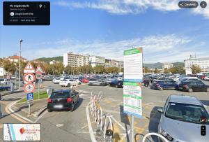 a parking lot with a lot of cars parked at La Finestra su Savona, Appartamento Centrale in Savona