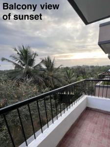 a balcony view of a resort with palm trees at shankara stays in Bangalore