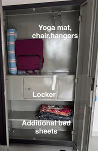 an open refrigerator with a chair in it at shankara stays in Bangalore +21 photos