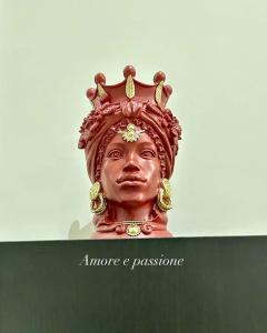 a bust of a statue with a crown on its head at Virginia Madre Boutique Guest House in San Benedetto del Tronto