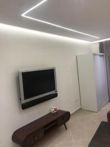 a living room with a flat screen tv on the wall at The view resort nabq in Sharm El Sheikh
