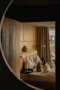 a bedroom with a bed with pillows on it at Chalet Mirabell in Avelengo +80 photos
