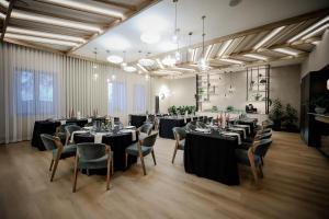 a large banquet room with tables and chairs at Pod Lipami in Bystra