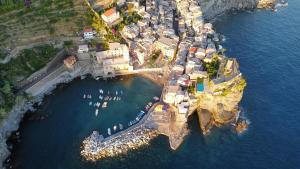 an aerial view of a small island in the water at la scogliera in Vernazza