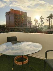 a table and chairs on the roof of a building at La Playa in Adeje
