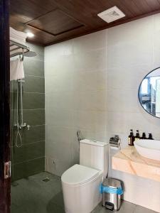a bathroom with a toilet and a sink at Sapa Landscape Homestay in Sapa