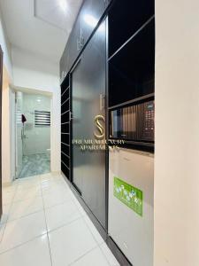 a bathroom with a wall with a sign on it at Premium Luxury Apartments in Abuja